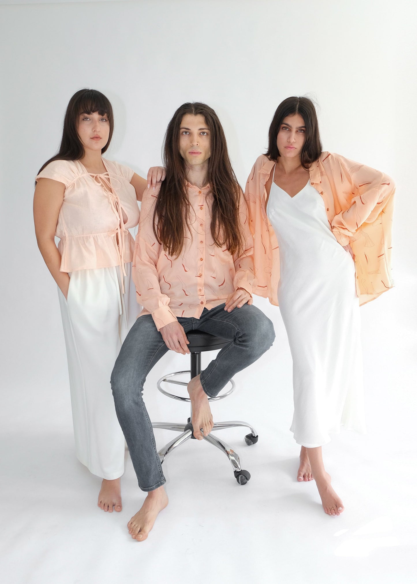 Three people in pink shirts